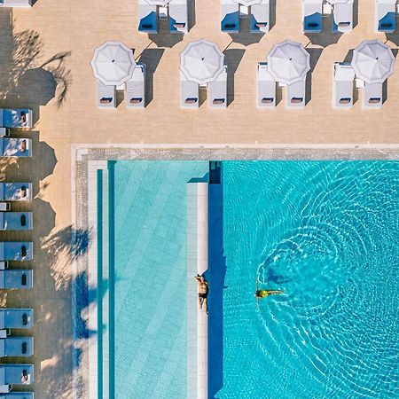 Ivi Mare - Designed For Adults By Louis Hotels Geroskipou Luaran gambar Aerial view of the pool at the Hotel du Cap-Eden-Roc, Cap d'Antibes, France
